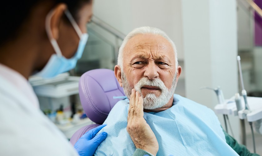 elderly-man-suffers-toothache
